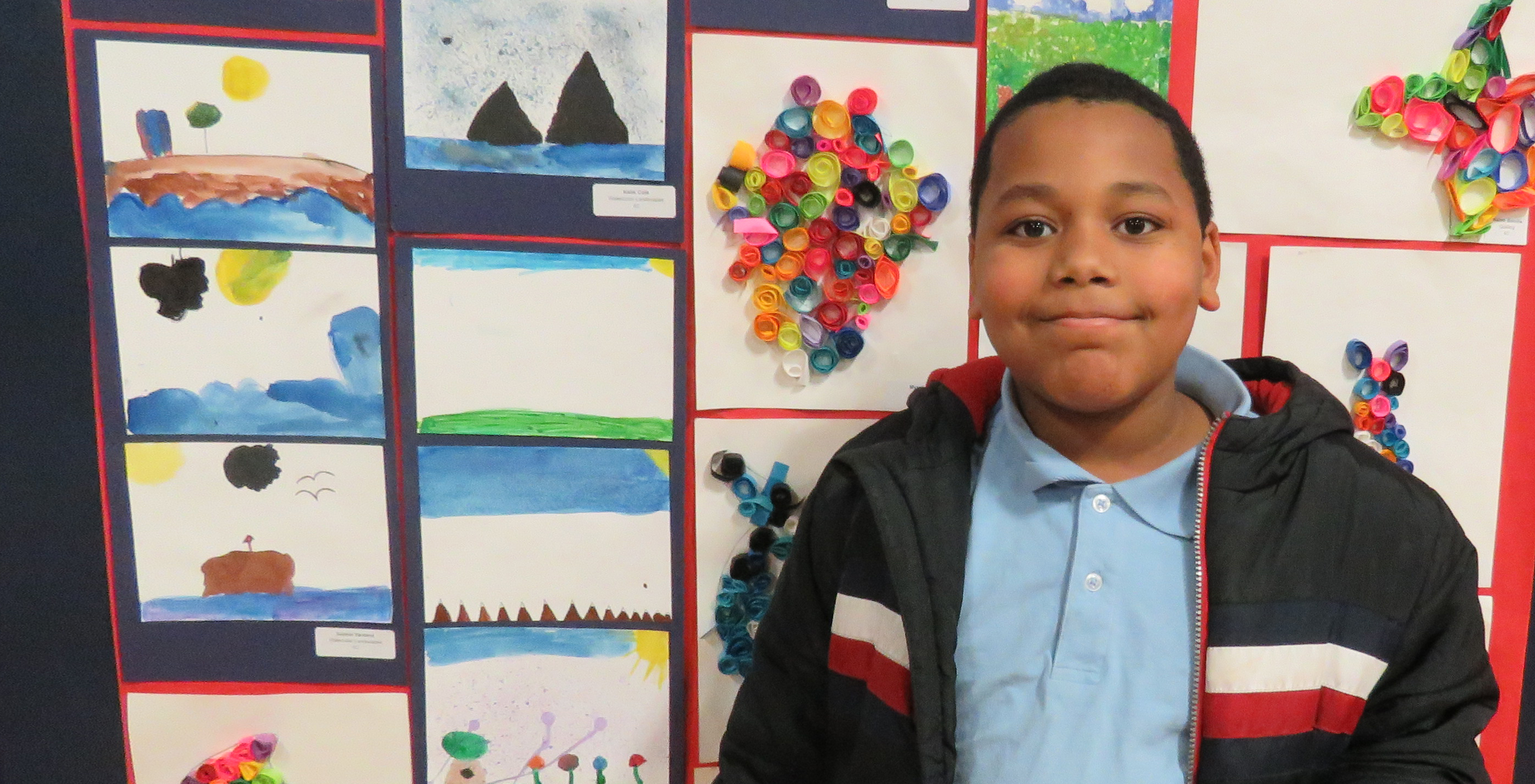 Syracuse Academy of Science Elementary School Student Presents Artwork During Winter Art Show