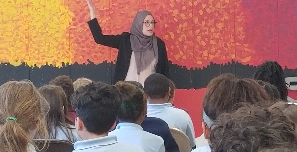 Ms. Aza Gradinic shared with middle school Atoms her life story growing up in Bosnia during the war, and connected them to the Universal Declaration of Human Rights.