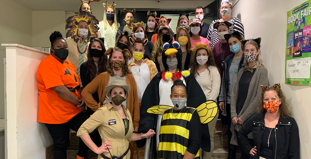 Syracuse Academy of Science elementary teachers and staff dress up as animals, and the principal, Mrs. Miller, as a zookeeper for the Fall Festival.
