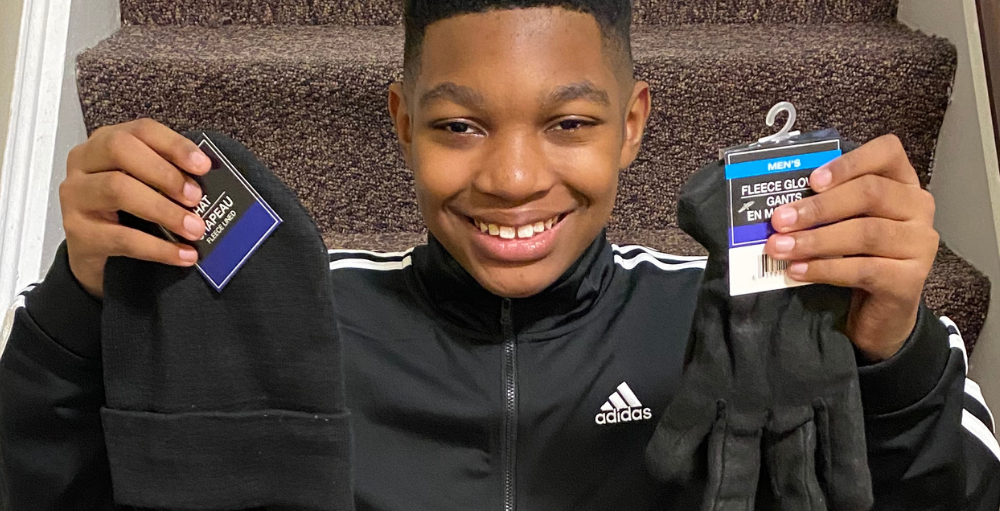 Syracuse Academy of Science middle school student Elijah Newsome creates care packages for the homeless as part of his ELA class assignment: Be the Change YOU Wish to See in the World.
