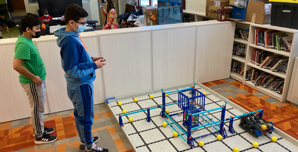 Syracuse Academy of Science middle school robotics team competes in 6-matches during their first-ever Robotics Competition.