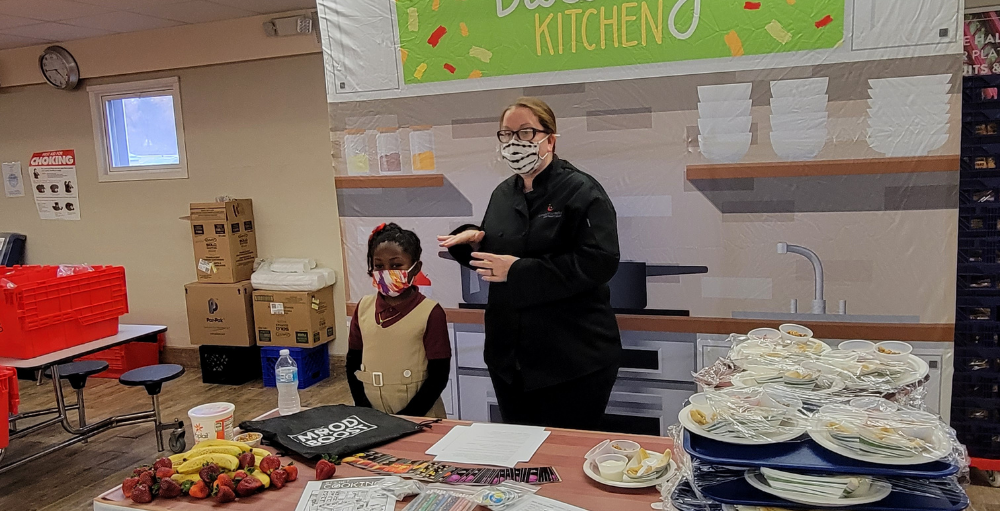 Syracuse Academy of Science elementary school Atoms learned how to make a fun healthy and nutritious snack using fresh fruit, granola and yogurt in the Discovery Kitchen.