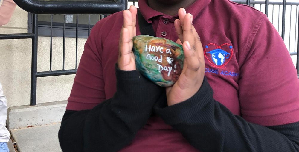 Syracuse Academy of Science Kind Kiddos Write Positive Affirmations on Rocks for December Project