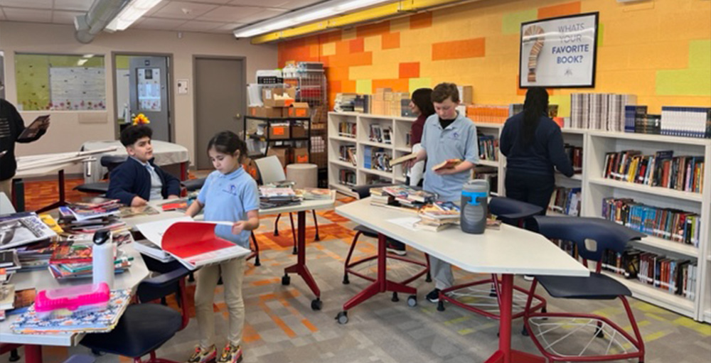 Syracuse Academy of Science Middle School Student Council Members Reorganize Library for Community Project