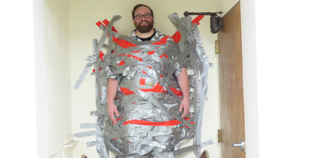 Mr. Farnach gets Duct-Taped to the Wall in Celebration of Syracuse Academy of Science Reading Challenge Achievement